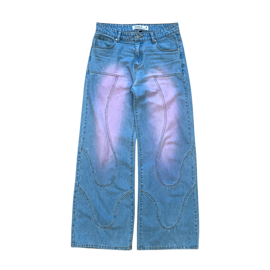This image displays a pair of light washed denim jeans, featuring an intriguing purplish-pink hue on the front and back thigh areas. The jeans are designed with a baggy fit that provides comfort and a stylish, casual look.